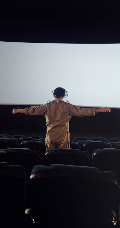 A Man Sitting Alone at the Cinema