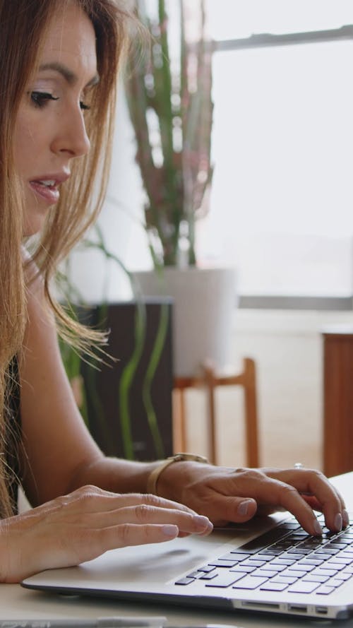 A Woman Browsing on Her Laptop