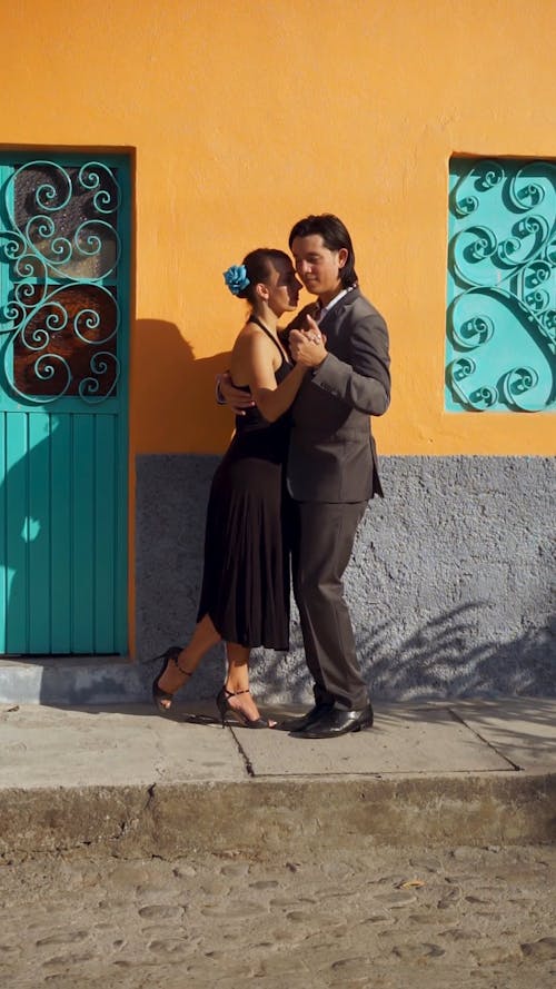 A Man and a Woman Dancing Tango in the Street