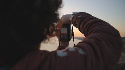 A Man Taking a Photo of a Beach in Australia