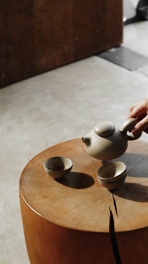 Pouring Tea on a Teacup