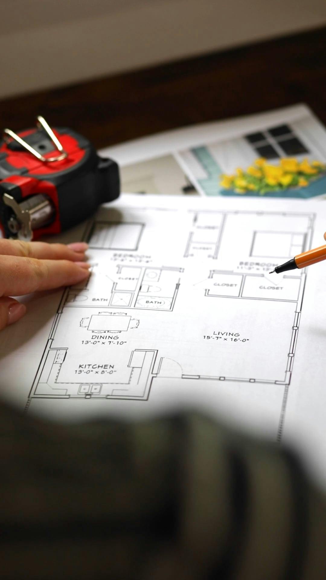 An Architect Writing on the Document Floor Plan · Free Stock Video