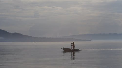 A Person Paddling on a Boat