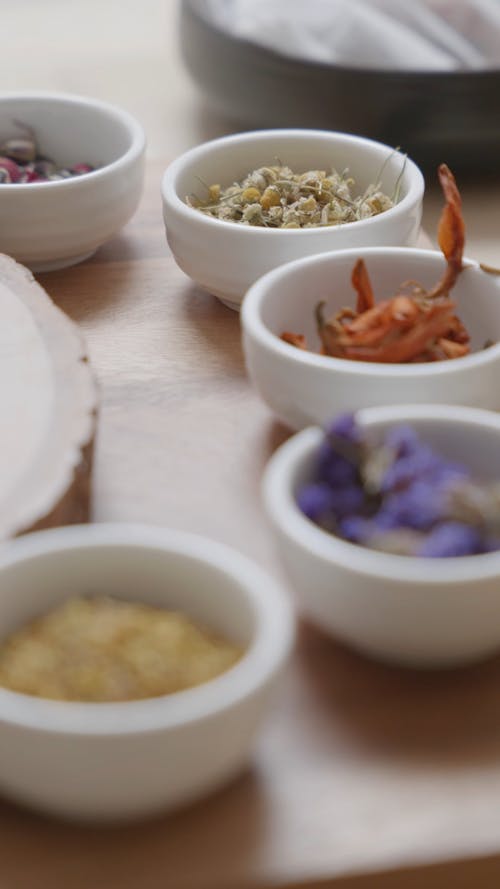 Close Up View of Different Dried Flowers in Small Bowls