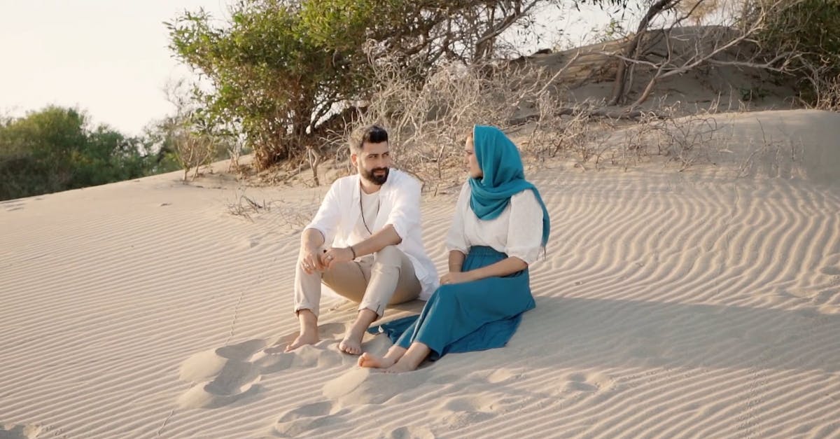 Couple Sitting on the Beach Sand Free Stock Video Footage, Royalty-Free