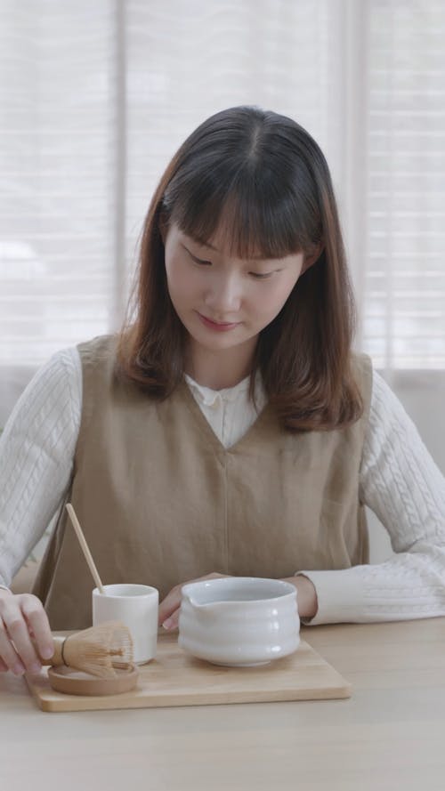 Woman Preparing Matcha Tea