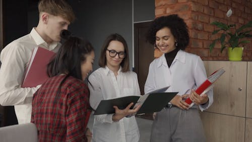 People Discussing a Document