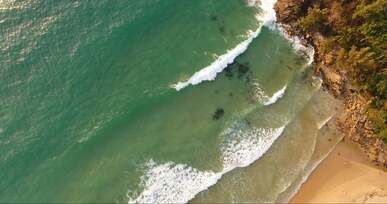 drone footage of beach waves