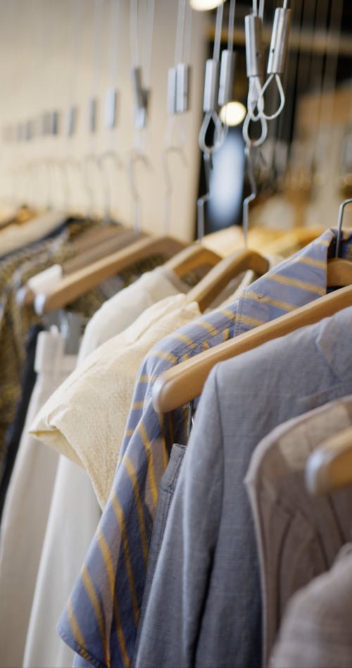 A Woman Touching Clothes at a Store