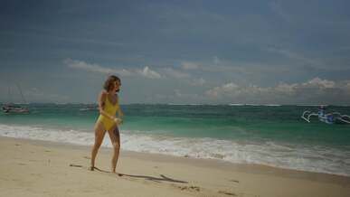 women walking on sand beach