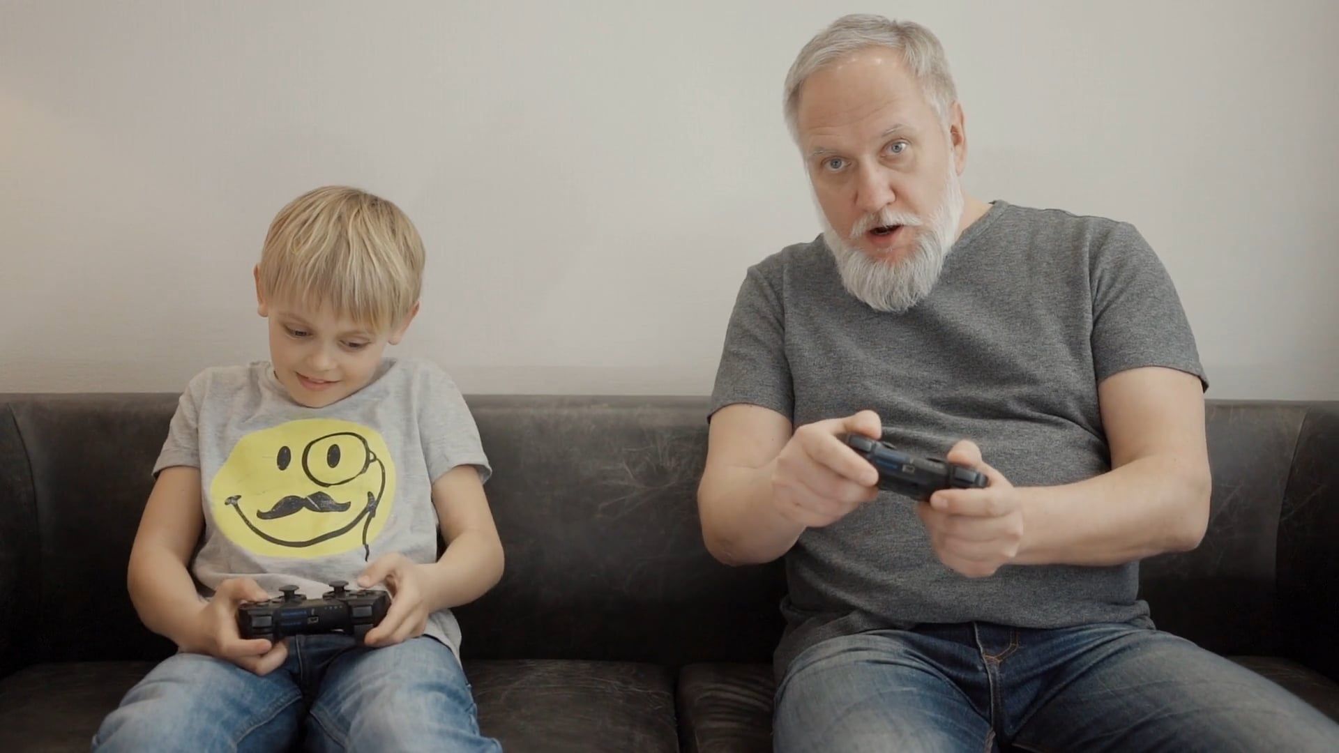 Little Boy and His Grandfather Playing a Video Game Free Stock Video ...