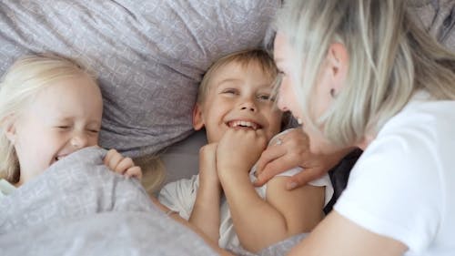 Grandmother Tickling Grandchildren