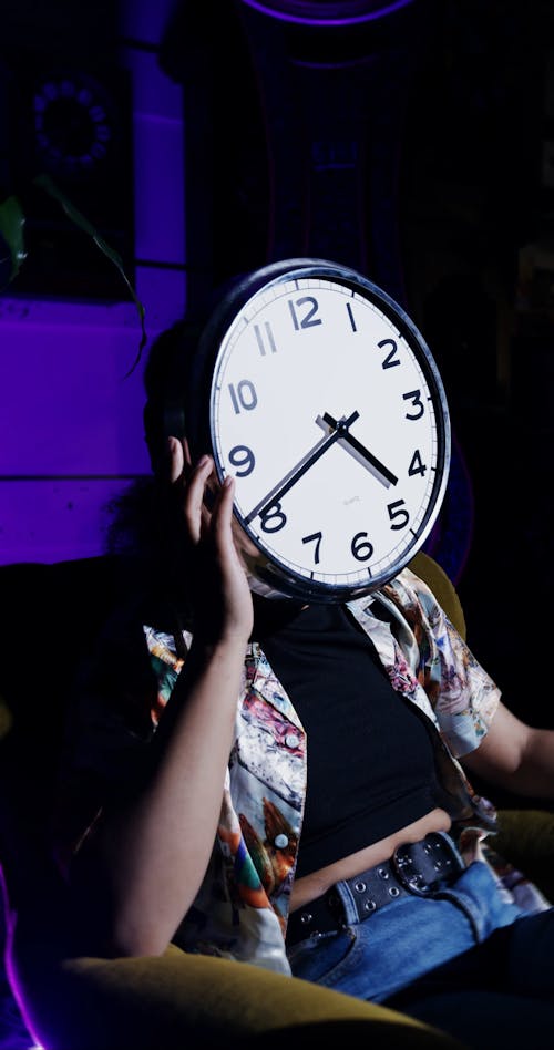 Person Posing With A Clock On Her Face