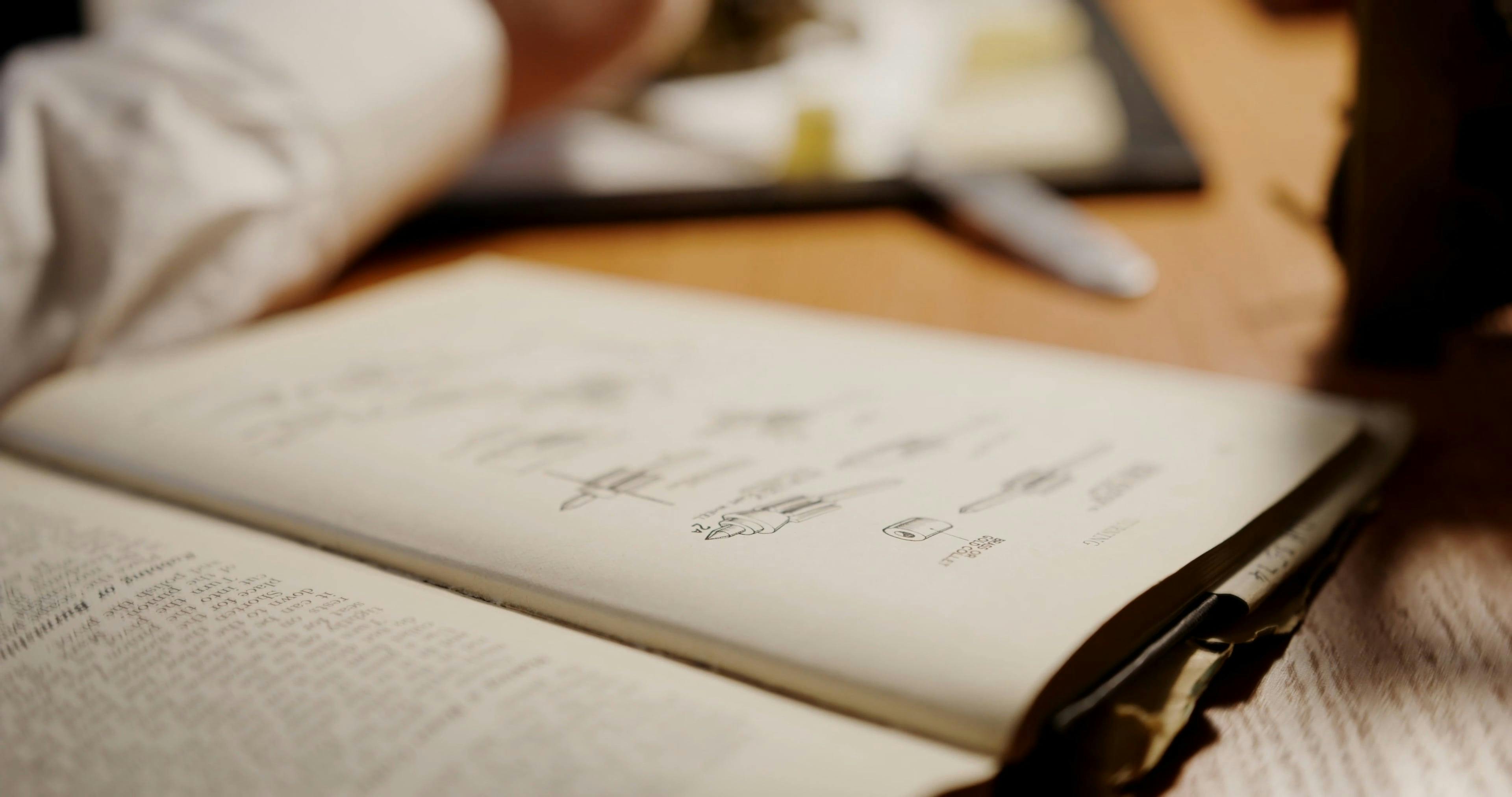 A Man Fixing a Watch While Following the Guide on the Book · Free Stock