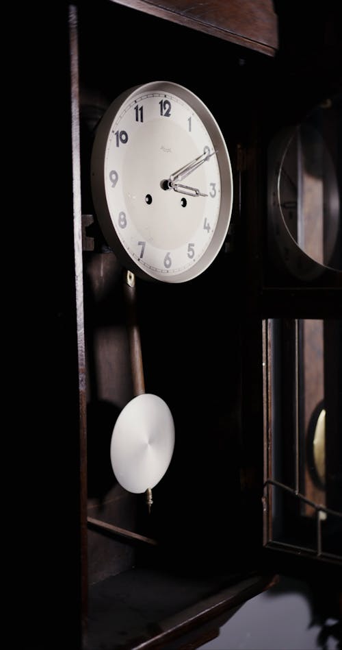 A Close Up View of a Pendulum Clock