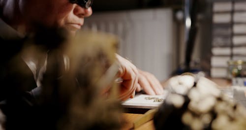 Elderly Man Repairing a Pocket Watch 