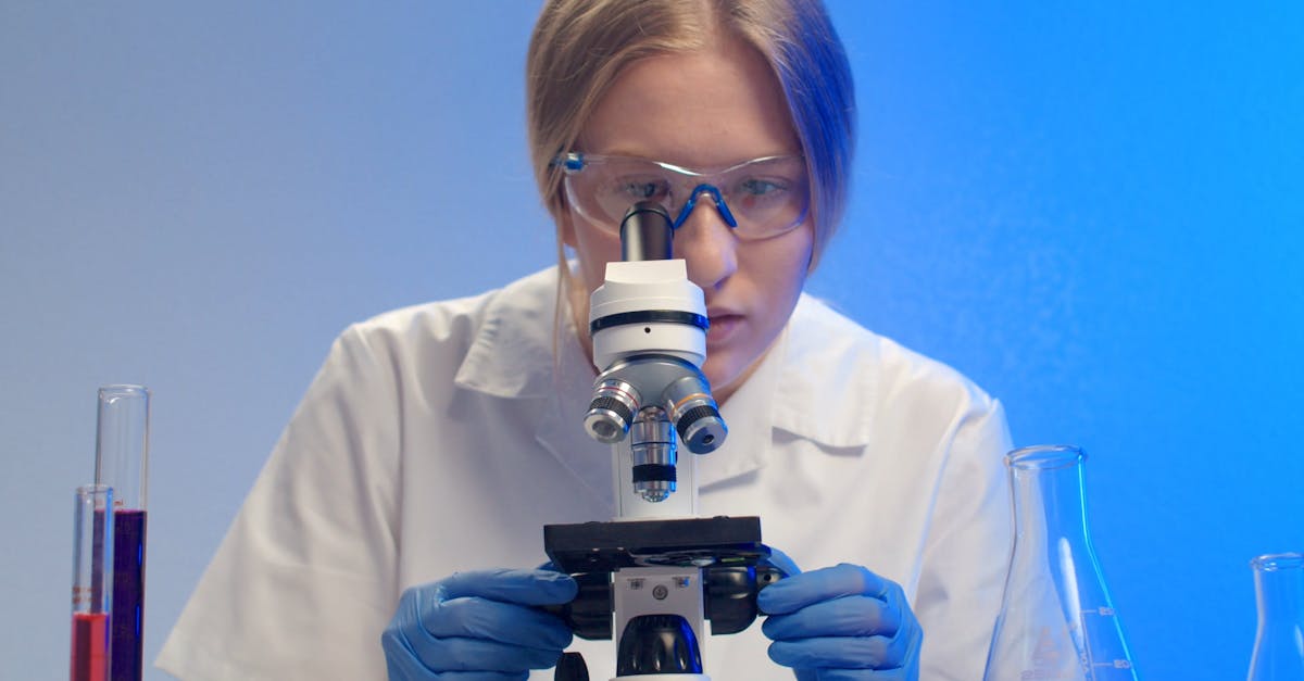 A Woman Observing Specimen Under A Microscope Free Stock Video Footage ...