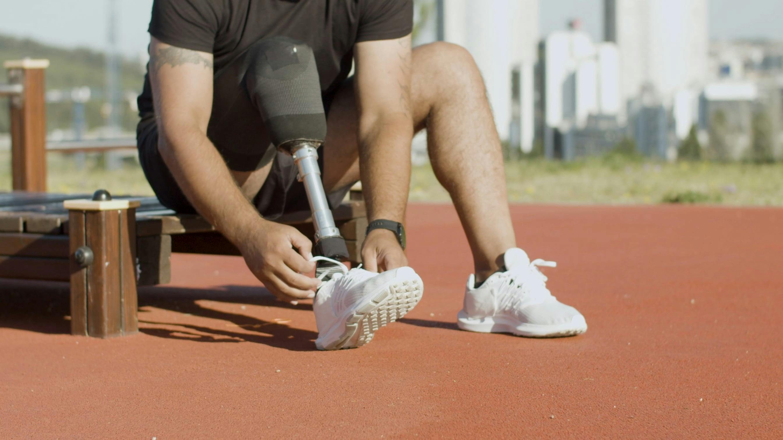 A Man With Prosthetic Leg Tying His Shoes · Free Stock Video