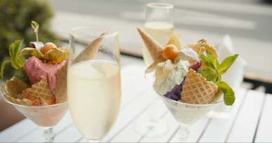 glasses of ice cream and glasses of champagne and a woman