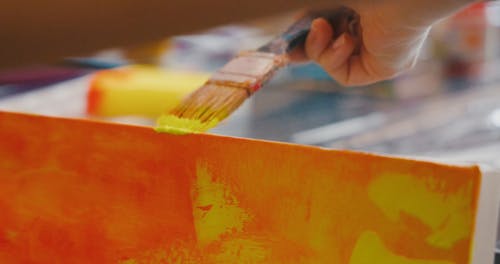 Close-Up Video of a Person Painting on Canvas