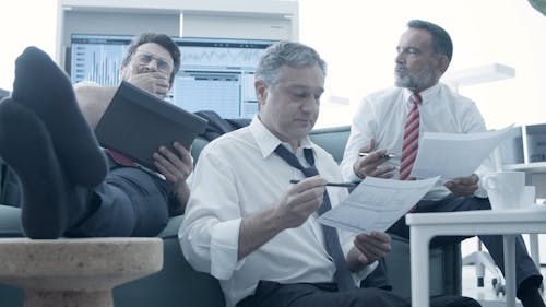 Tired Businessmen Working in the Office