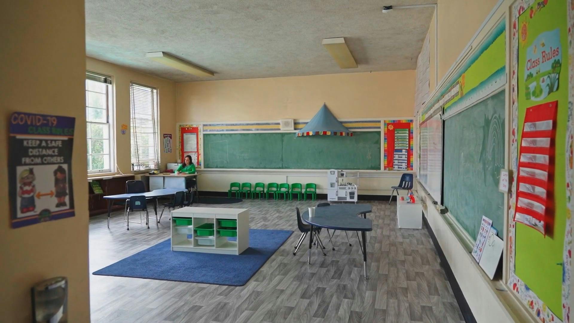 A Teacher Working in an Empty Classroom · Free Stock Video