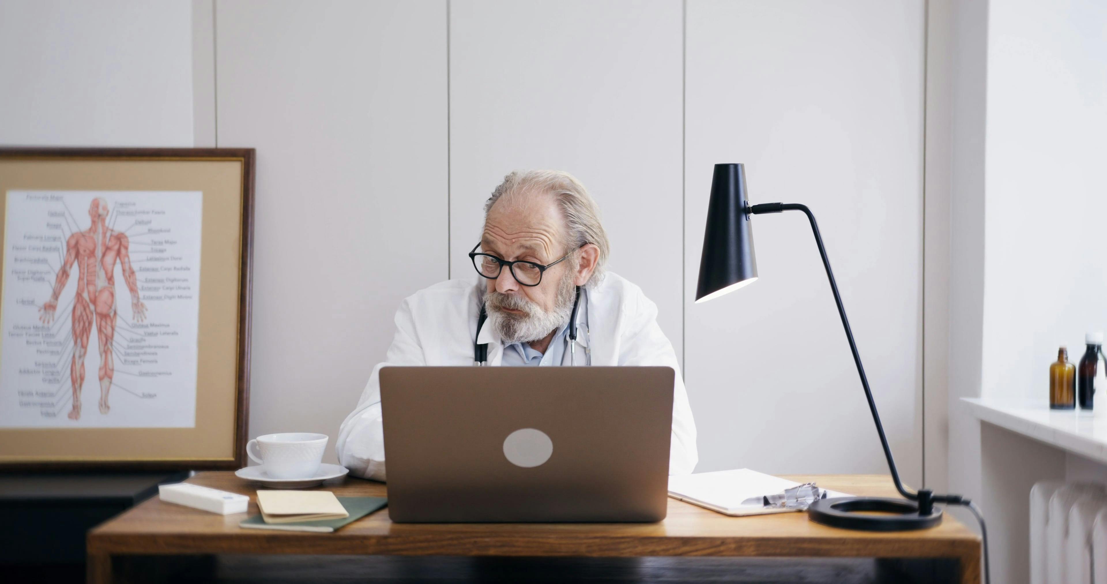 Doctor Using Laptop for Online Consultation \u00b7 Free Stock Video