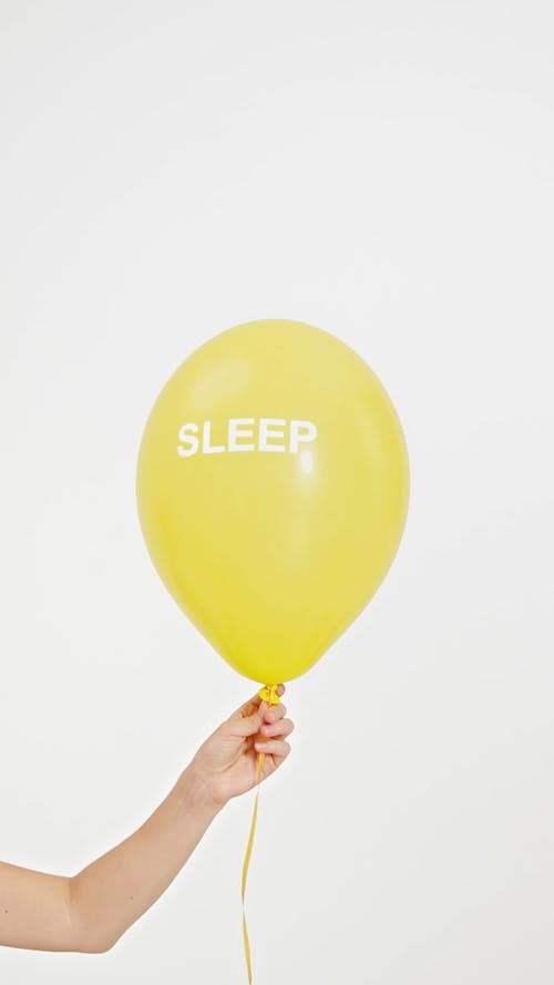 Word Sleep Printed on a Yellow Balloon