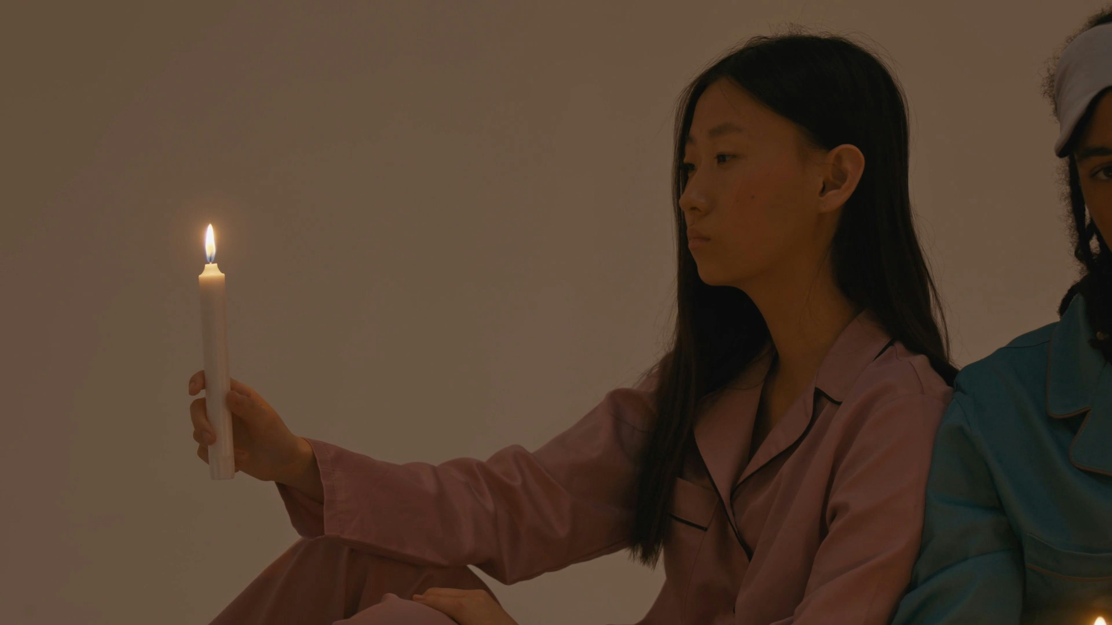 Models Holding Lighted Candles Free Stock Video Footage, RoyaltyFree