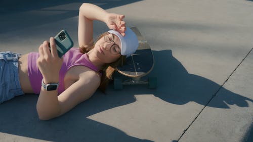 Girl Resting Her Head on a Skateboard