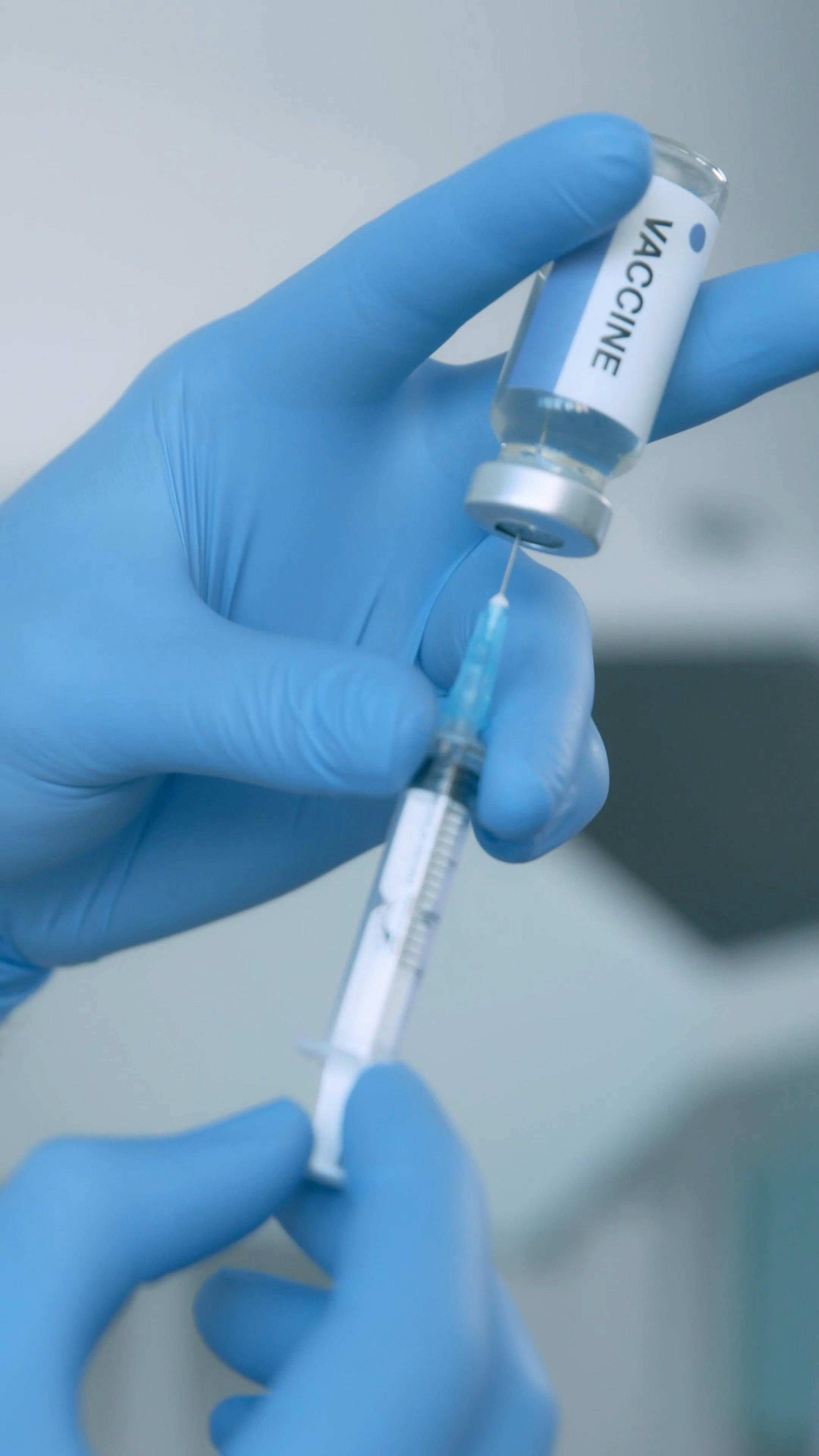 Video of a Hands Holding a Syringe · Free Stock Video