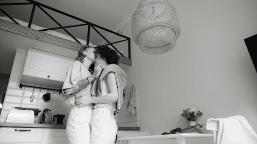 A Couple Dancing Together in a Kitchen