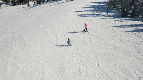 Drone Footage of People Skiing Together