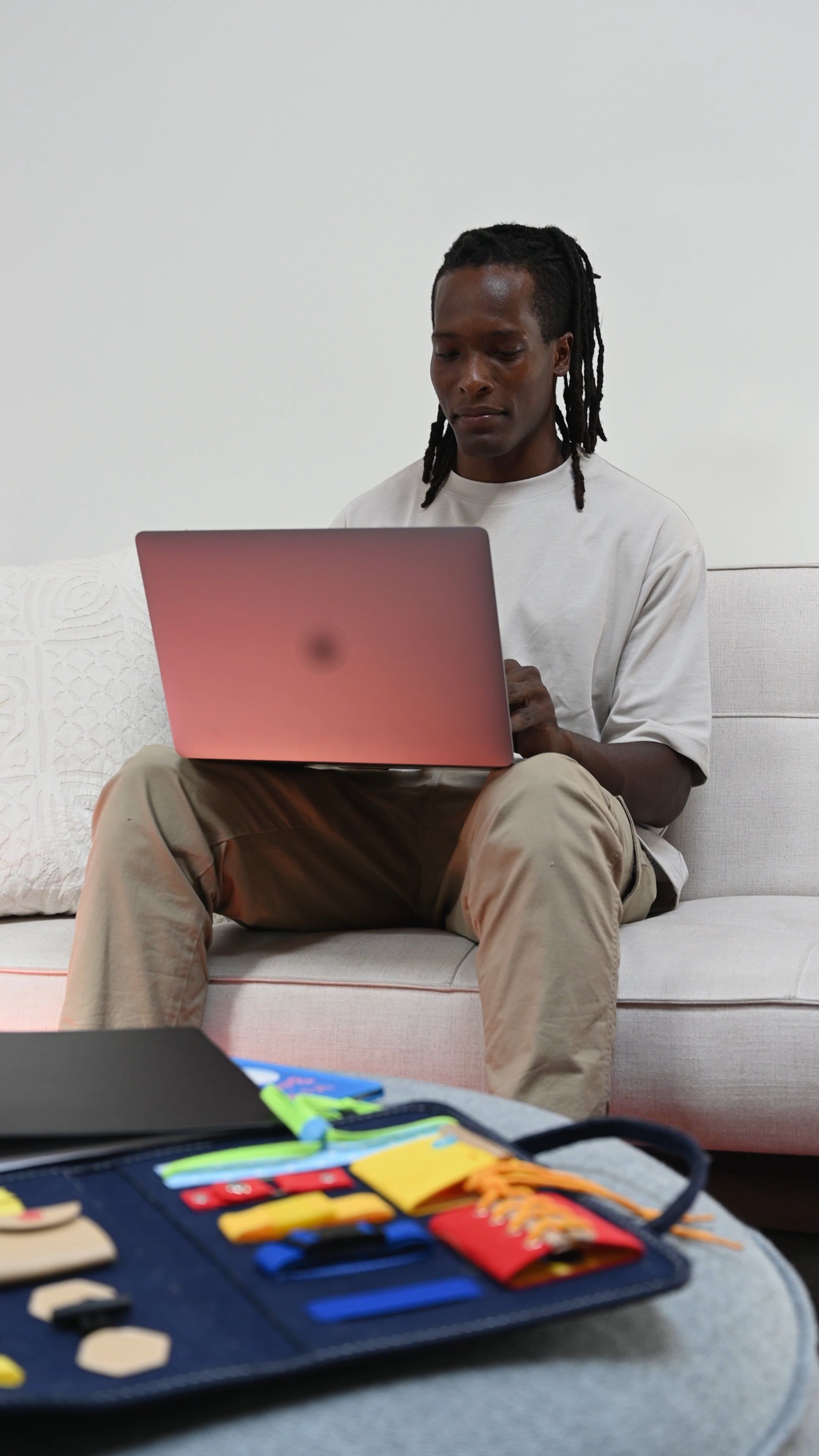 Man Using A Laptop While Sitting On a Sofa · Free Stock Video