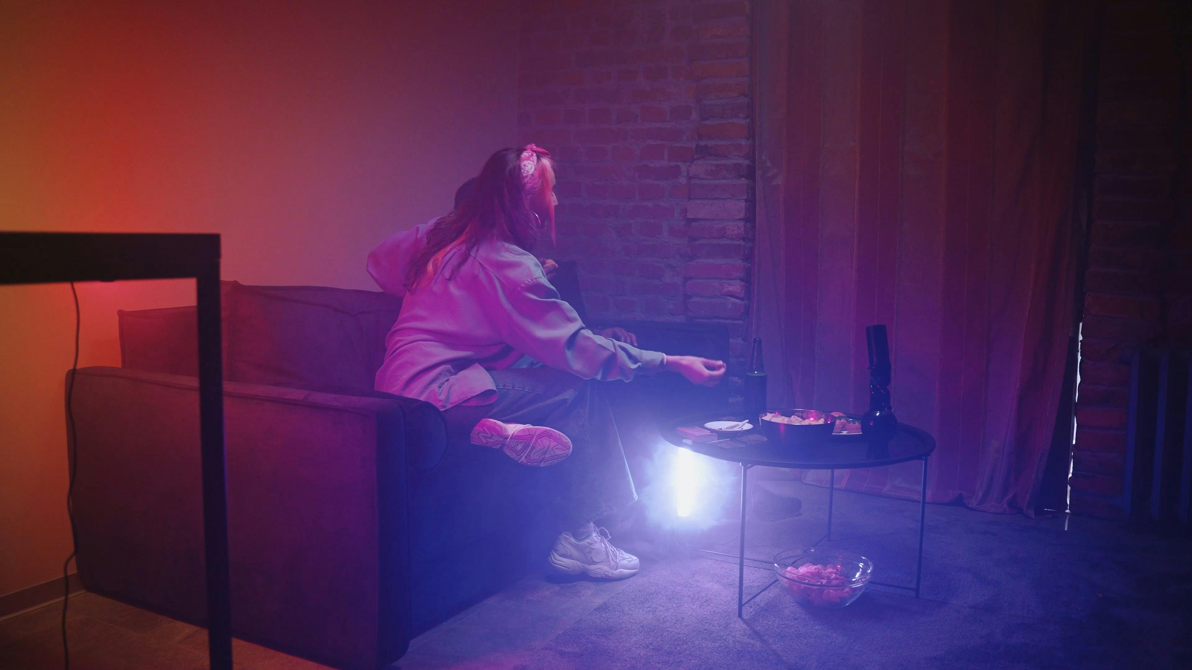 A Man and a Woman Talking on the Couch at a Party · Free Stock Video