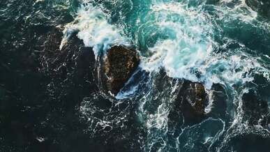 waves splashing on rocks