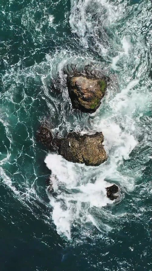 Birds Eye View of Crashing Waves on the Rock