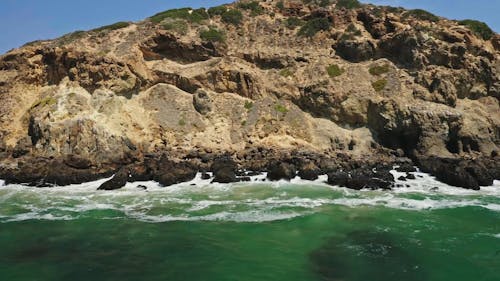 Waves Crashing on Rock Formation