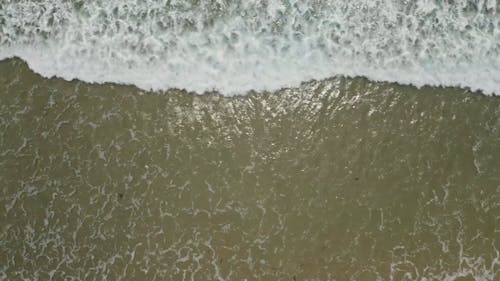 Sea Waves Kissing The Beach Shore