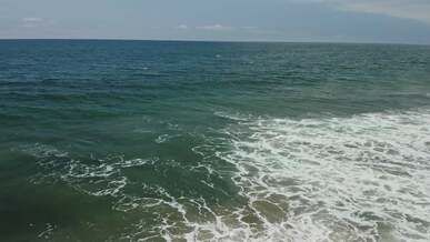 drone footage of a sea and waves