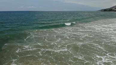 sea waves rushing towards the shore