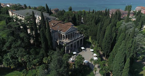 Aerial View of a Mansion Surrounded by Trees