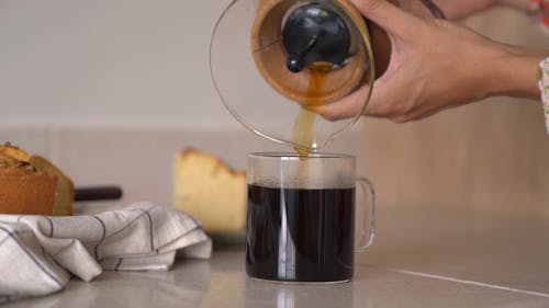 Pouring Coffee To a Cup