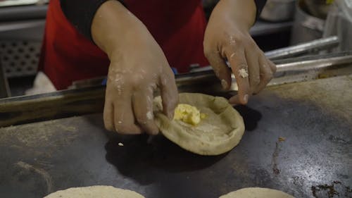 A Person Making a Tortilla Wrap