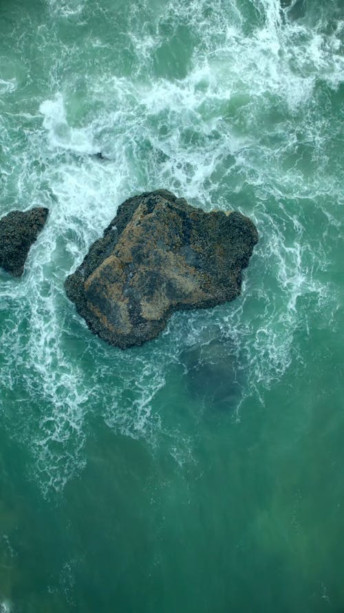 Waves Crashing the Rock Formation