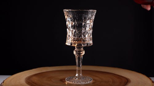 A Person Pouring Cocktail into a Cocktail Glass