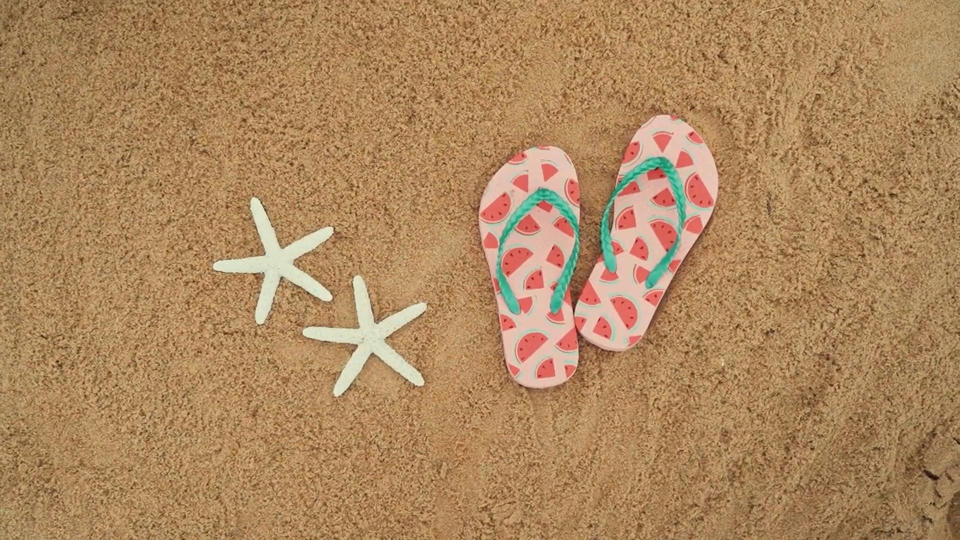 A Starfish and Flip Flops on the Beach Sand Free Stock Video Footage