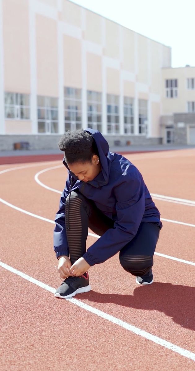 an athlete tying her shoelace 8456209 — free pexels stock footage