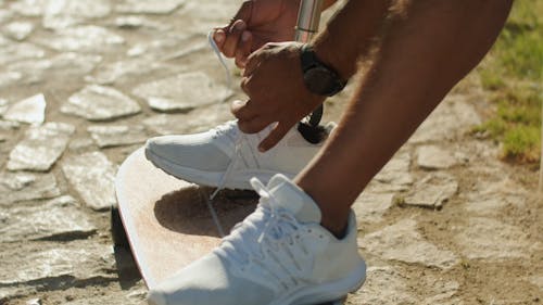 A Person Tying Shoelace