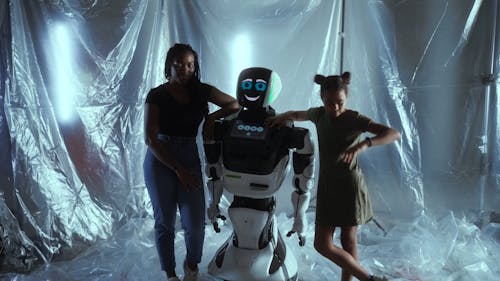 Video of Girl Standing Beside Robot